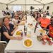 El Campo de Peñaranda despide sus fiestas del Corpus con una paella popular en la carpa animada por la charanga El Tinglao